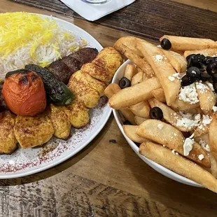 Chicken and Beef with Rice and Grilled Tomatoes.  Appetizer was Greek Fries with dipping sauce.