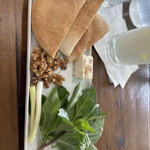 Complementary starter plate with meal purchase. Warm pita, feta, walnuts, onion and herbs. A perfect start for an Iranian meal.