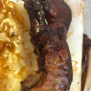 a piece of meat and mashed potatoes