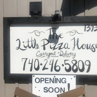 a sign for opening soon