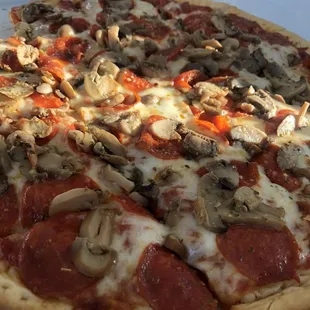 Pepperoni and mushroom pizza