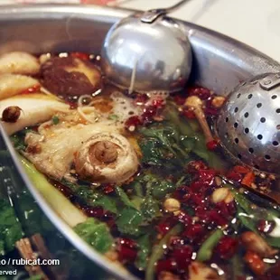 The spicy, fragrant mala broth, with lamb and mushrooms.