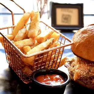 Fried Chicken Sandwich--comes with fries. Crunchy fried chicken, candied bacon, and cabbage-avocado slaw. $15