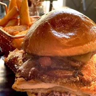 Fried Chicken Sandwich--comes with fries. Crunchy fried chicken, candied bacon, and cabbage-avocado slaw. $15