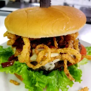 a burger with onion rings