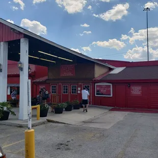 a man standing in front of the building