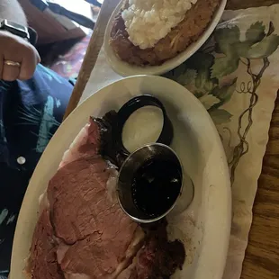 Queen cut prime rib with au jus and horsey sauce and hashbrowns with cheese and onion