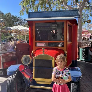 6 year old granddaughter posing after buying our corn dogs.