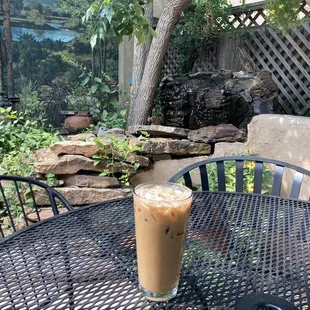 A refreshing iced coffee on the peaceful patio.