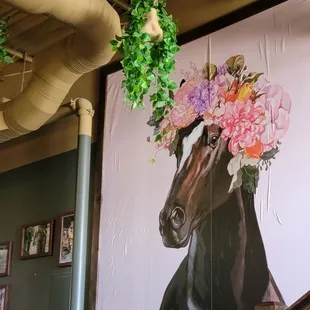 a horse with flowers on its head