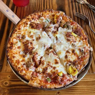 "All Around Joe Supreme" Pepperoni, Sausage, Bacon, Bell Peppers, Mushrooms, Onions, Banana Peppers, Green and Black Olives, Mozzarella