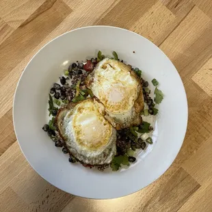 quinoa salad with fried eggs.