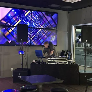 a dj working on a laptop