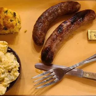 Hot link, brat, jalapeño cornbread and potato salad
