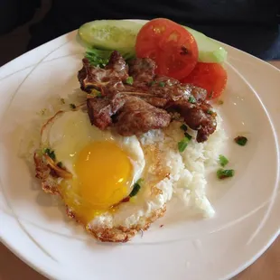 Pork chop with fried egg and jasmine rice