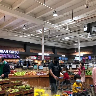 people shopping in a grocery store