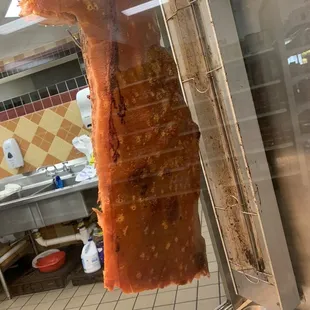 a piece of meat hanging from a rack