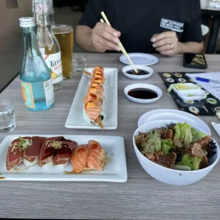 a man eating sushi at a restaurant