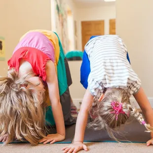 Practicing yoga poses!  We have a teacher who teaches yoga once a week to our toddlers and preschoolers.