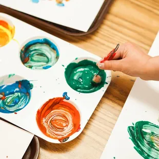 Children explore different art mediums on a daily basis
