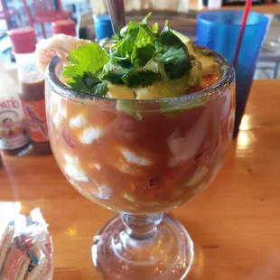 a drink in a glass on a table