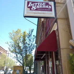 The sign outside the restaurant to attract people to come in.