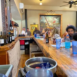 a group of people sitting at a bar