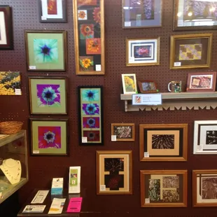 Framed photos by Robin Field of Robin&apos;s Nest Creations inside Little Shops.