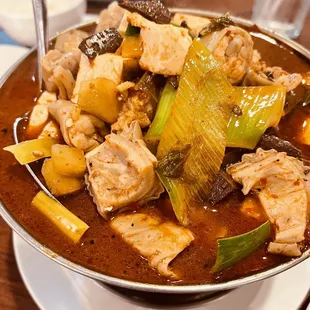 a bowl of stew with meat and vegetables