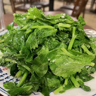 a pile of spinach on a plate