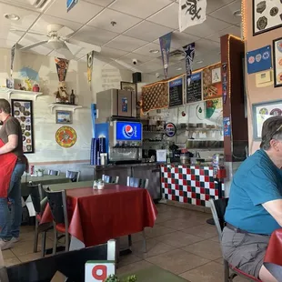 The front end area where you place order, soda machine, other available tables to seat yourself