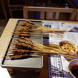 Lamb (bottom) and beef belly (top) skewers.