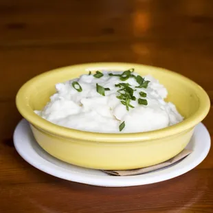 a yellow bowl of cottage cheese