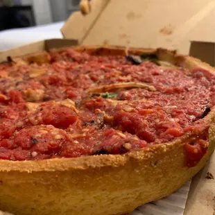 a deep dish pizza in a box