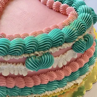a pink and blue cake
