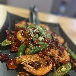 A shovel-full of dry cooked shrimps. It comes with its "kaka" so, get ready to use your hands.