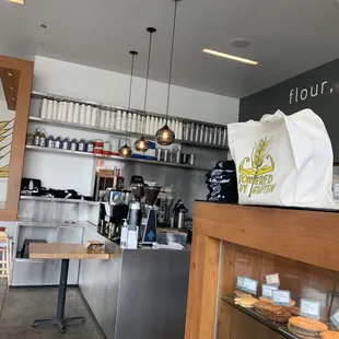 a counter with a bag of doughnuts