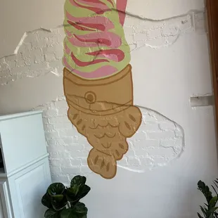 an ice cream cone painted on a wall