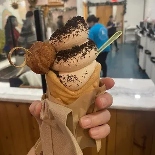 Holiday special of gingerbread ice cream with Oreo powered toppings and the cone is lined with cookie butter!