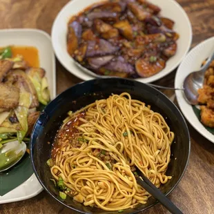 a variety of dishes of food on a table