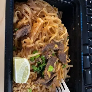 a plate of noodles and a fork