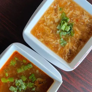 two bowls of soup on a table