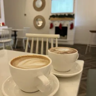 two cups of coffee on a table