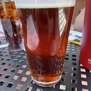 a glass of beer on a table