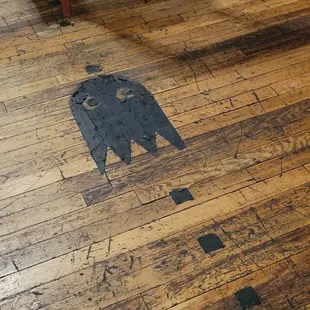 Pacman ghosts, fruit and dots on the brewery floor