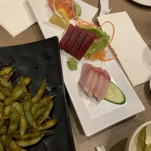 Sashimi and spicy edamame appetizers