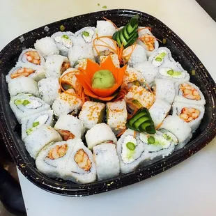 a plate of sushi rolls on a table