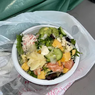 Poke salad with salmon, crab and avocado.