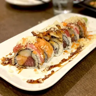 a sushi roll on a white plate
