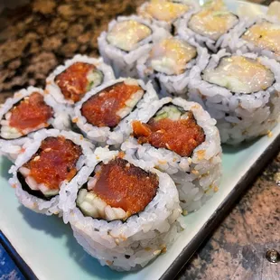 a plate of sushi rolls on a table